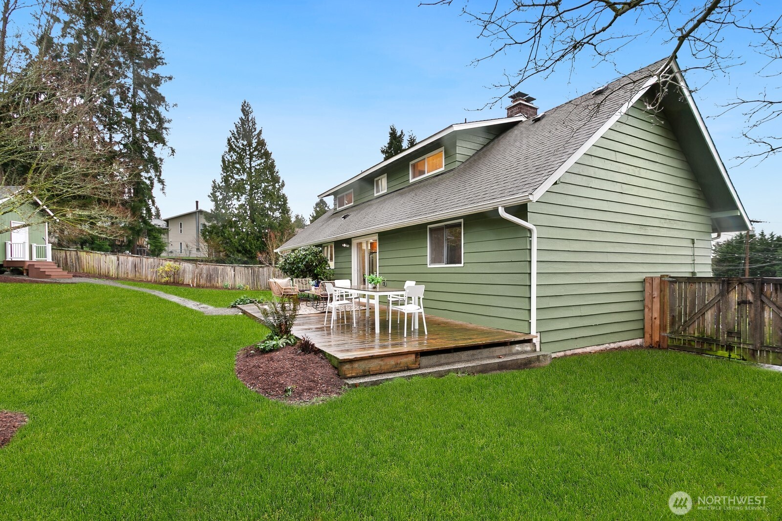 20008 101st Place Northeast Bothell, WA 98011 - Photo 23 of 23 a view of a chair and table in backyard of the house