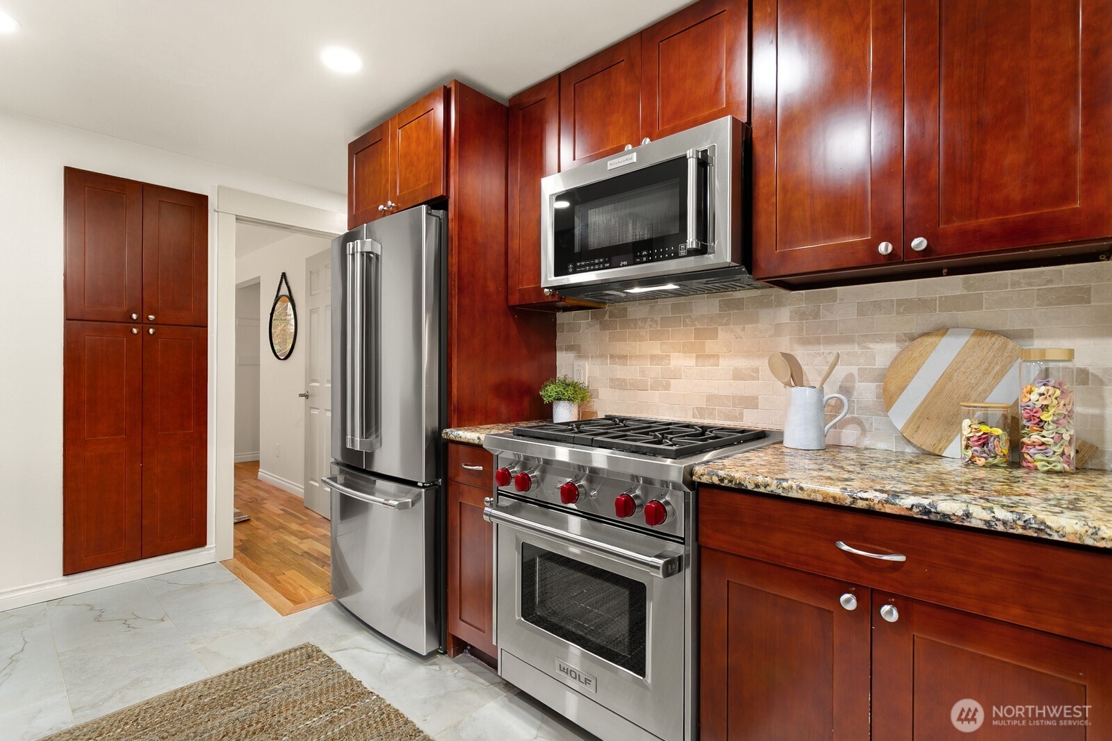 20008 101st Place Northeast Bothell, WA 98011 - Photo 9 of 23 a kitchen with stainless steel appliances granite countertop a stove microwave and refrigerator