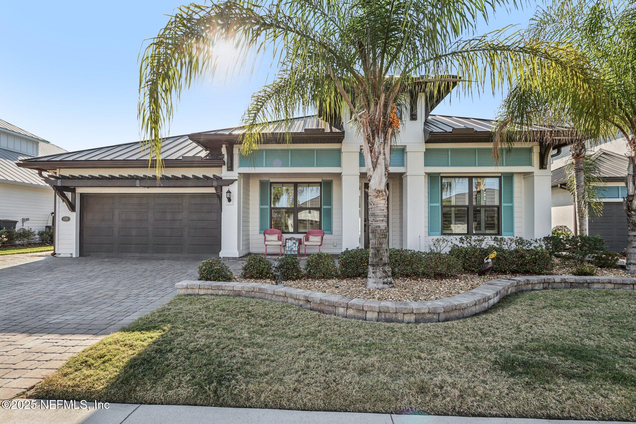 front view of a house with a yard