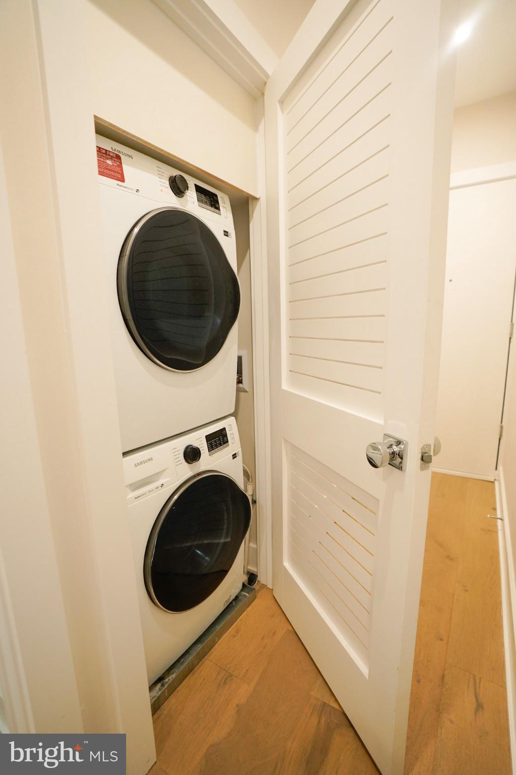 1421 Spring Road Northwest Washington, DC 20010 - Photo 3 of 12 Compact laundry nook with modern appliances.