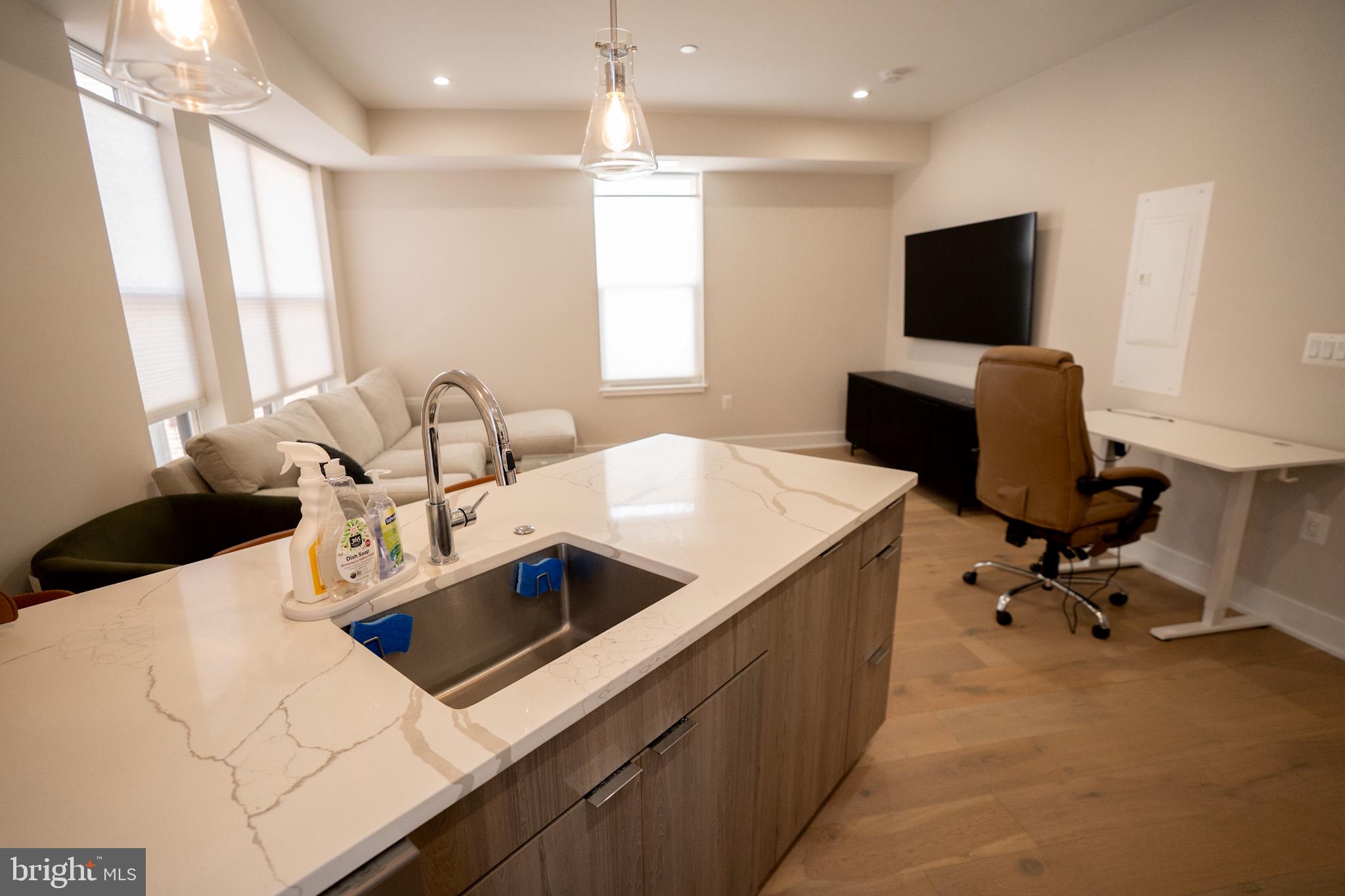 1421 Spring Road Northwest Washington, DC 20010 - Photo 3 of 12 Modern kitchen with sleek finishes.