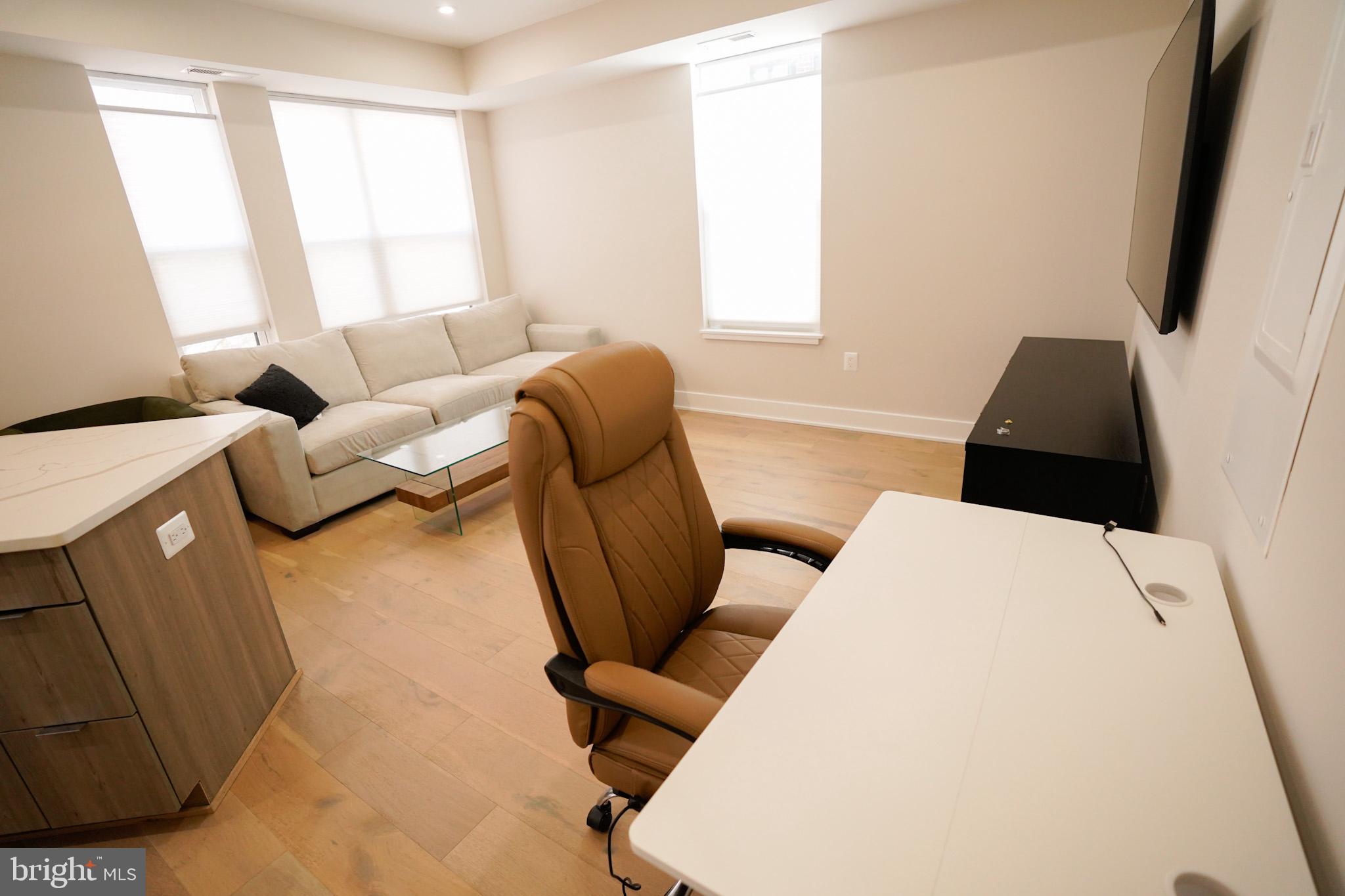 1421 Spring Road Northwest Washington, DC 20010 - Photo 6 of 12 Modern workspace with natural light.