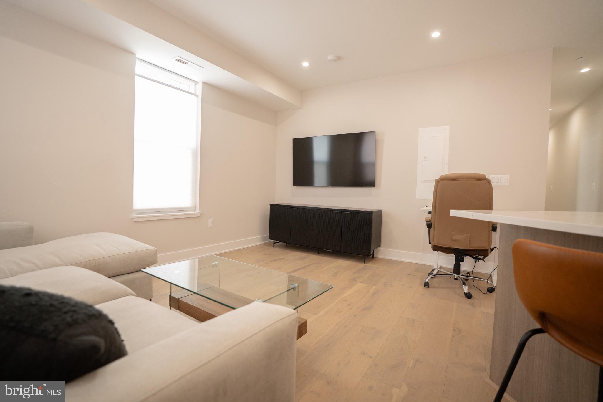 1421 Spring Road Northwest Washington, DC 20010 - Photo 8 of 12 Modern living space with natural light.