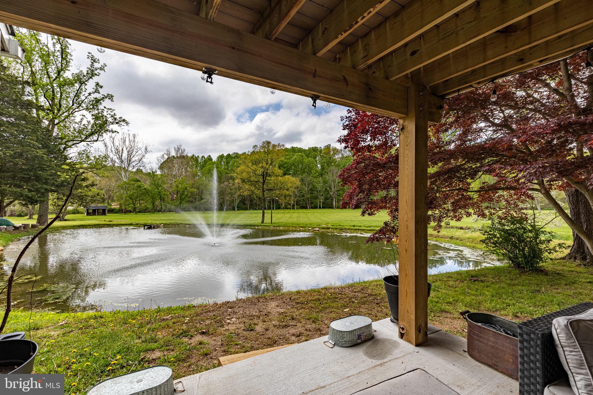 2310 Putnam Road Forest Hill, MD 21050 - Photo 40 of 90 Tranquil pond view under a wooden porch.