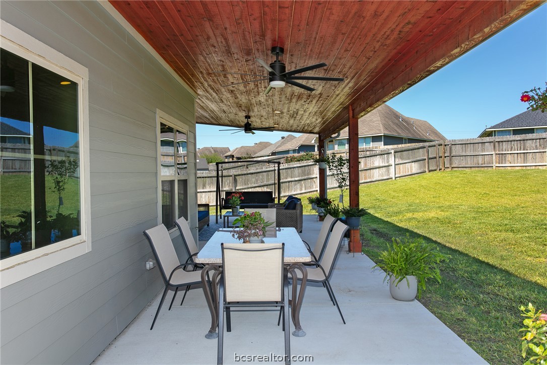 2071 Positano Loop Bryan, TX 77808 - Photo 27 of 31 a dining room with furniture and garden view