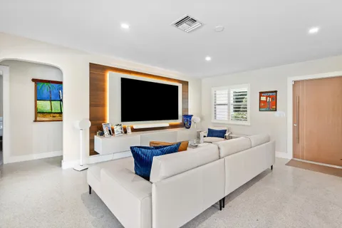 a spacious bedroom with a bed and a window
