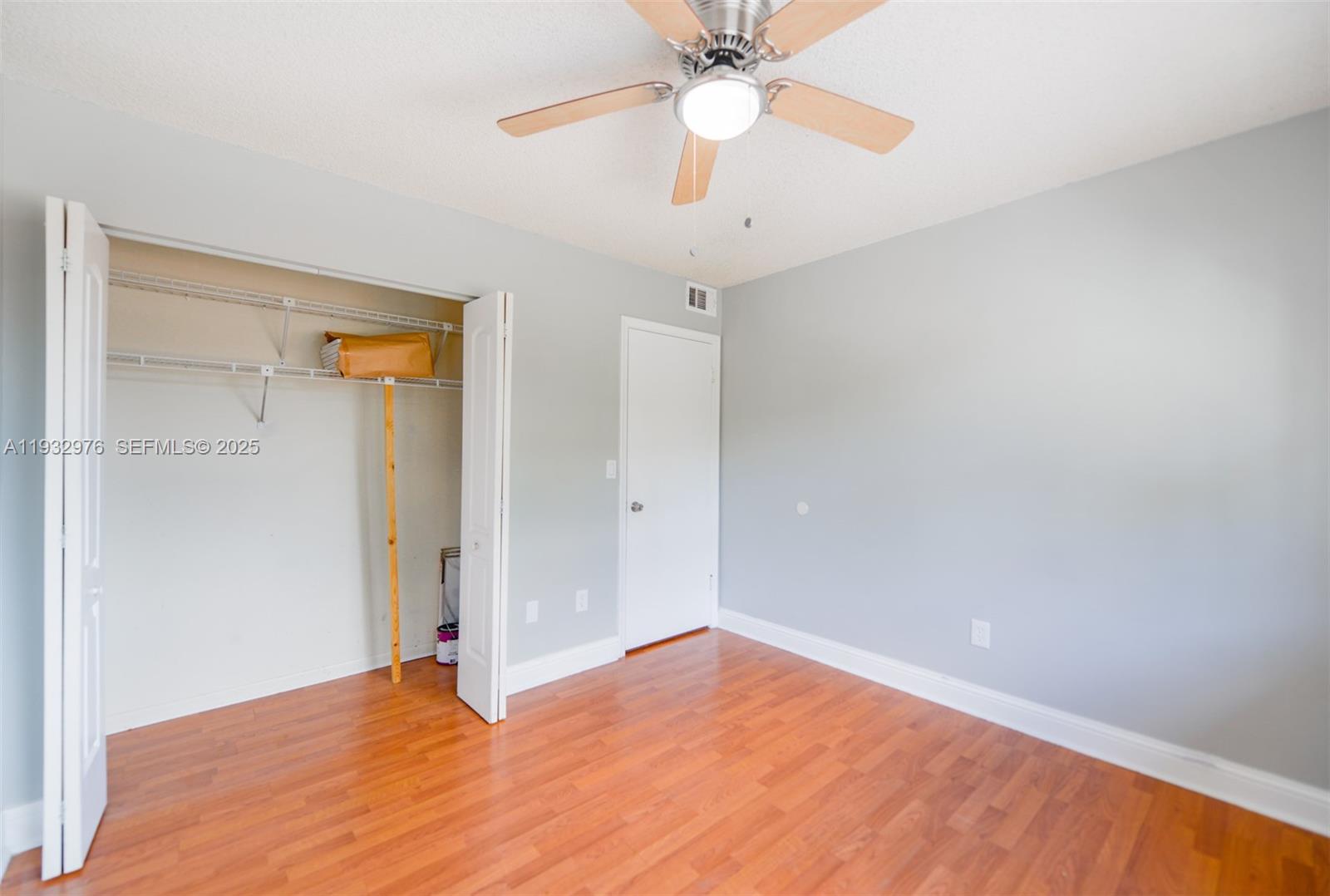 2570 West 67th Place, Unit 212 Hialeah, FL 33016 - Photo 19 of 33 an empty room with a fan and a fan