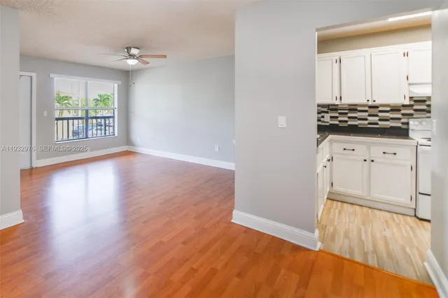 a view of kitchen with wooden floor