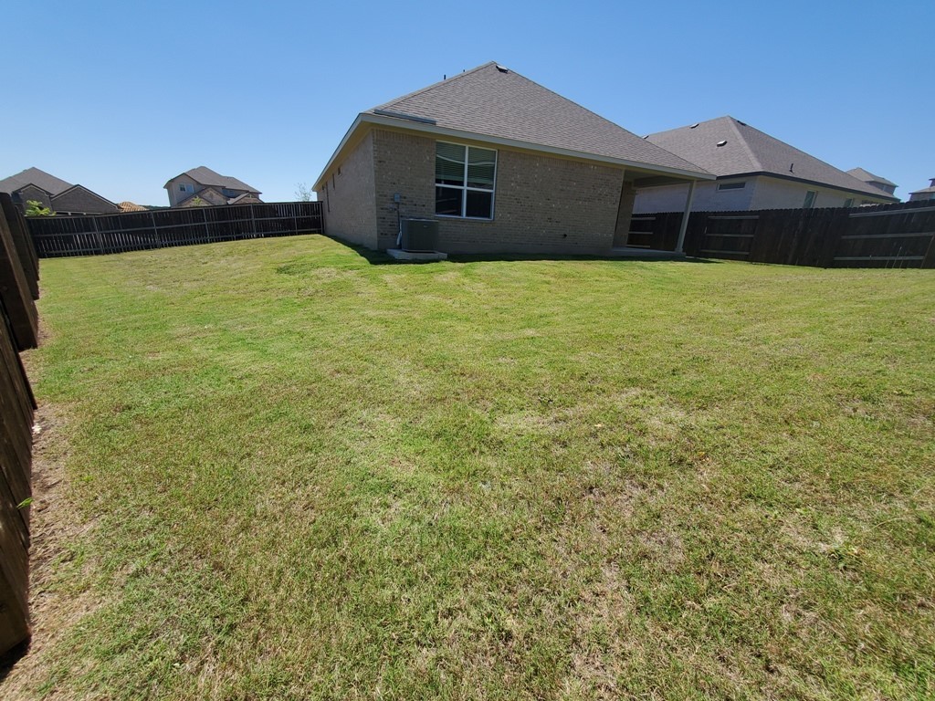 648 Peace Pipe Way Georgetown, TX 78628 - Photo 12 of 12 a house with yard in front of it
