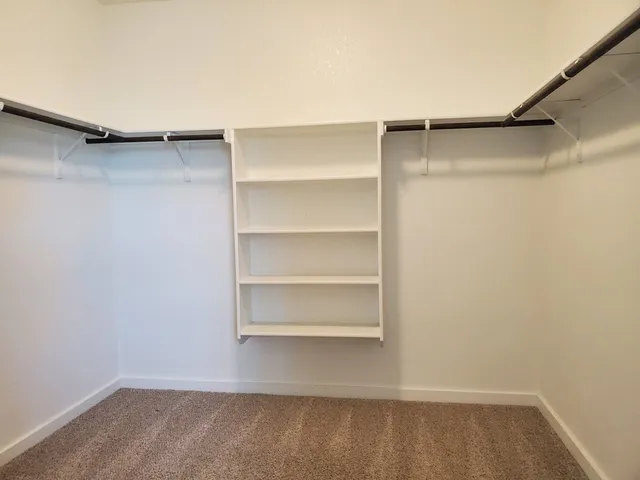 a view of an empty walk in closet