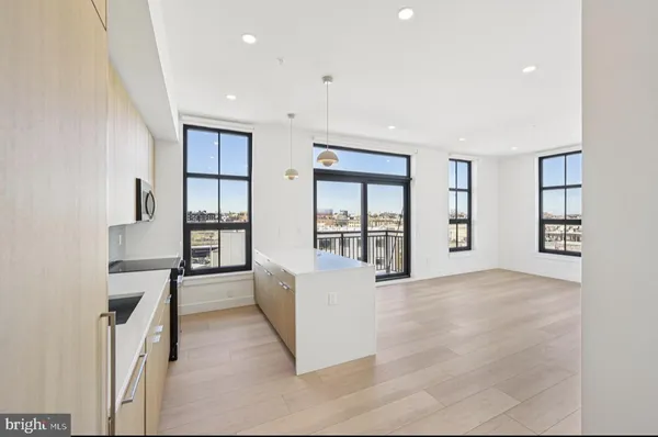 wooden floor in an empty room with a window and wooden floor