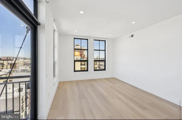 a view of livingroom with hardwood floor and hallway
