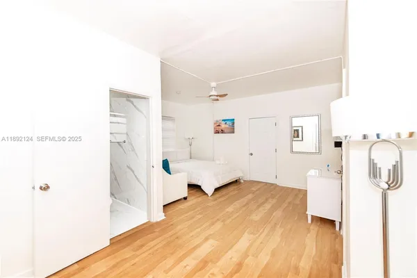 a kitchen with cabinets appliances a sink and a window