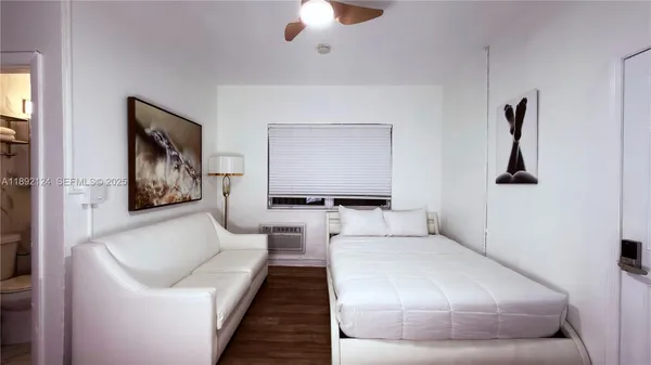 a view of a room with a table and chairs