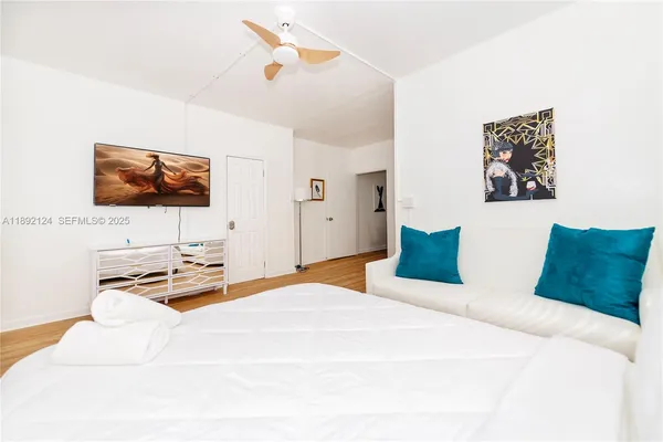 a bedroom with a bed and a couch