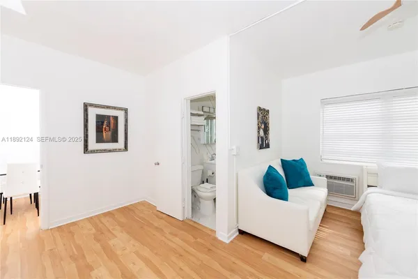 a kitchen with cabinets appliances a sink and a window