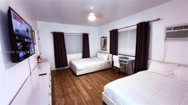 a bedroom with a bed and a couch