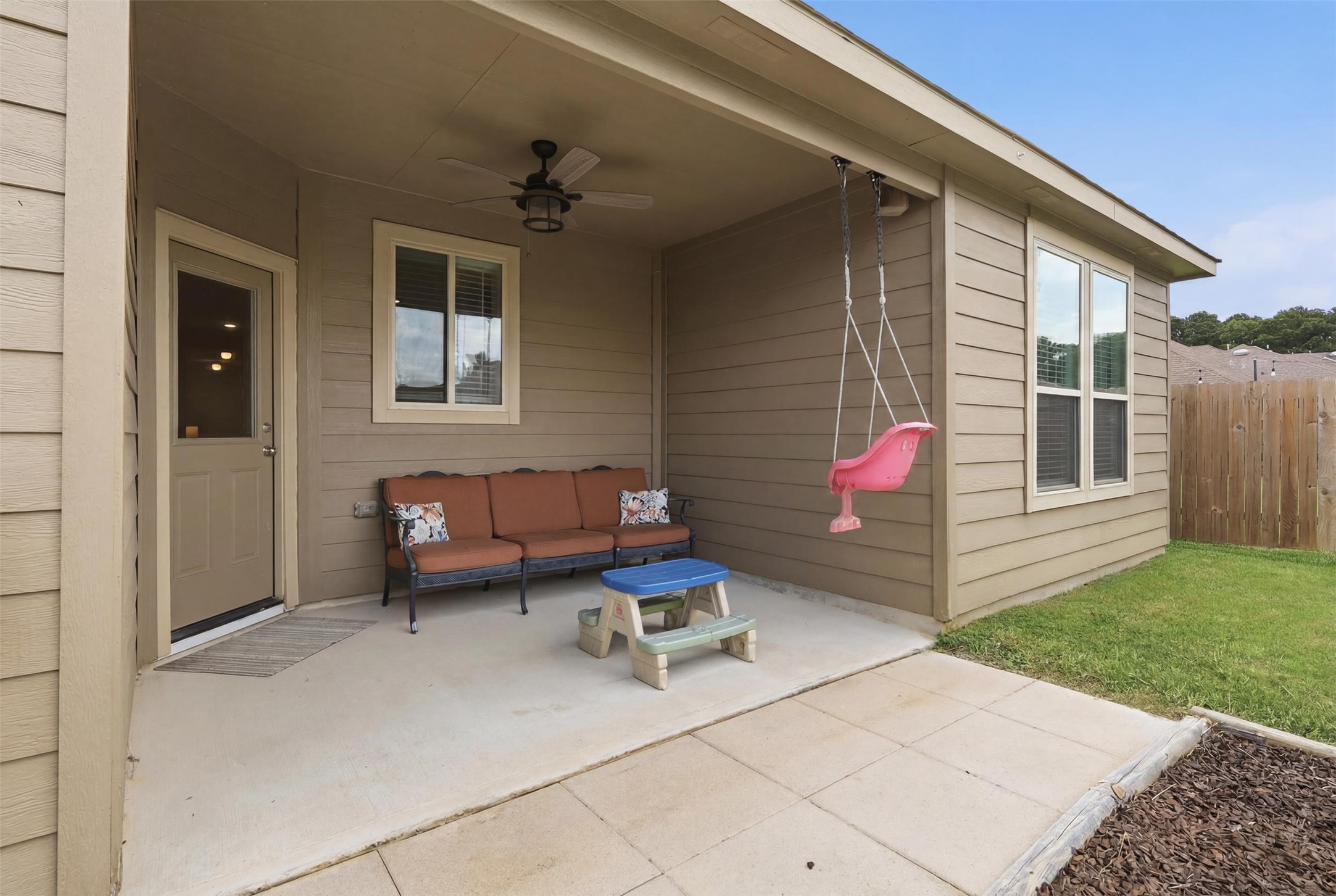 9739 Birdsnest Court Spring, TX 77379 - Photo 30 of 38 Covered back patio offering a comfortable outdoor living space ideal for relaxing, grilling, or entertaining while overlooking the backyard.
