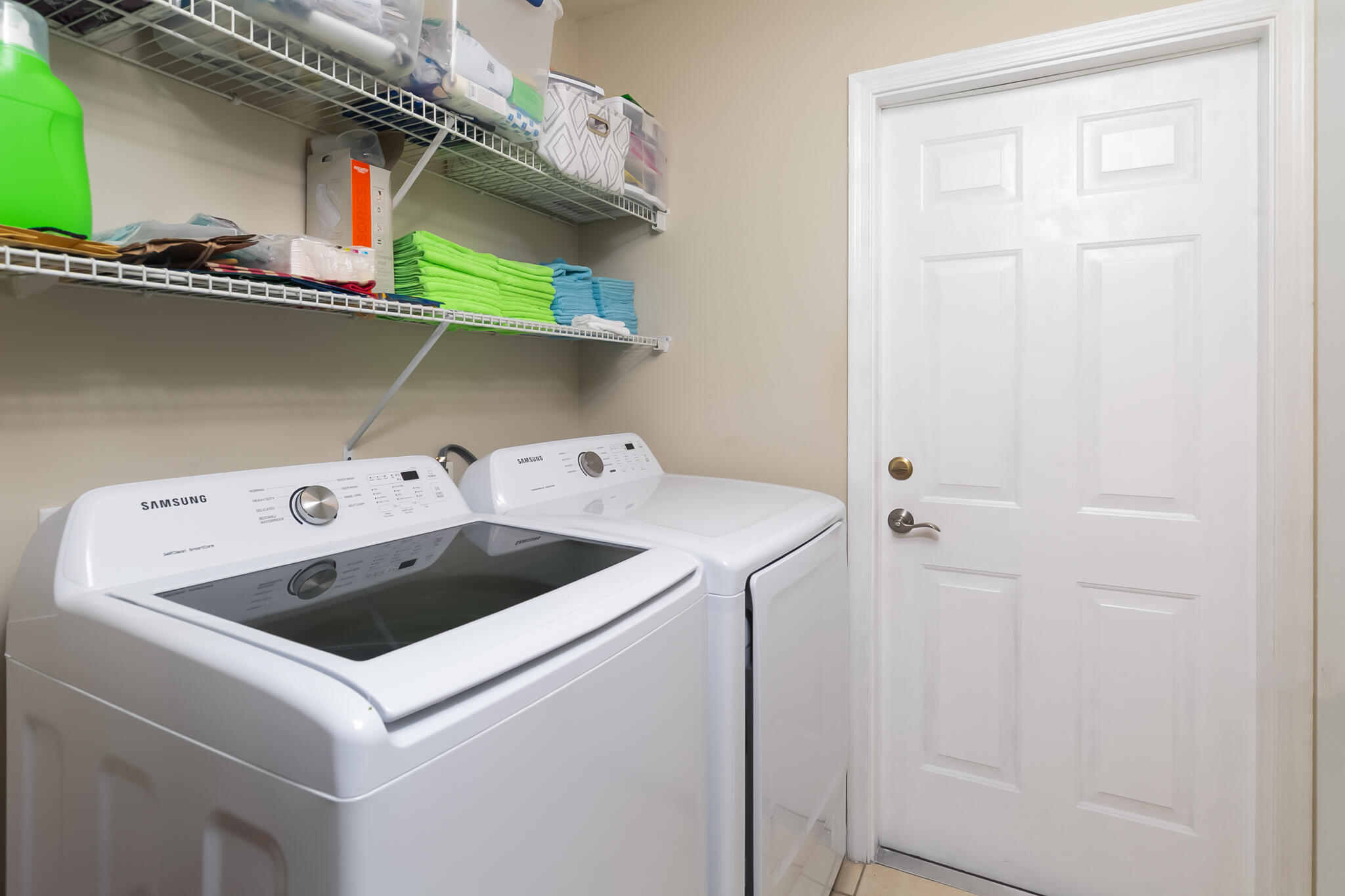 2065 Southwest Gemini Lane Port St. Lucie, FL 34984 - Photo 22 of 24 a utility room with dryer and washer