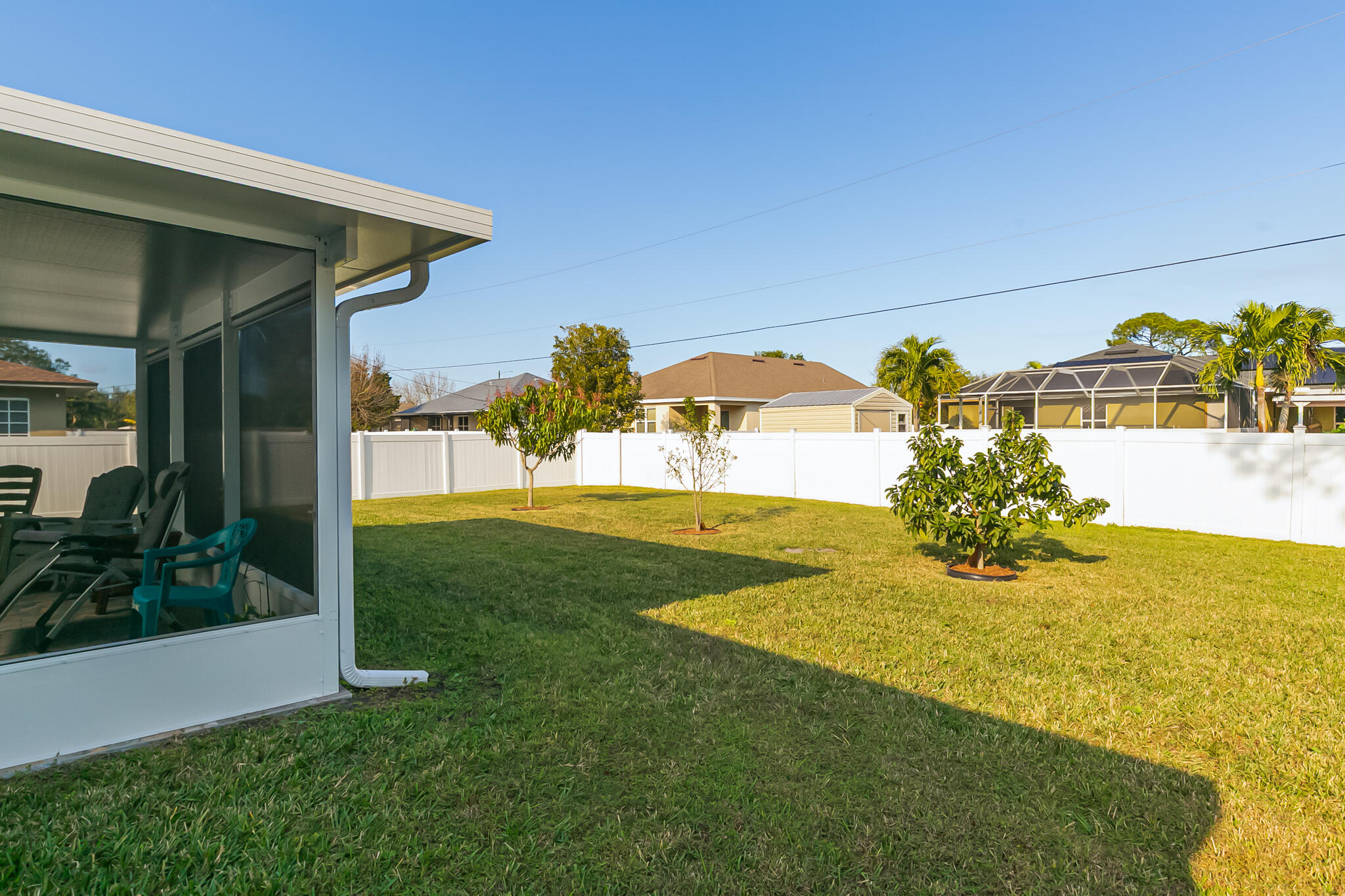2065 Southwest Gemini Lane Port St. Lucie, FL 34984 - Photo 24 of 24 a view of a house with a yard