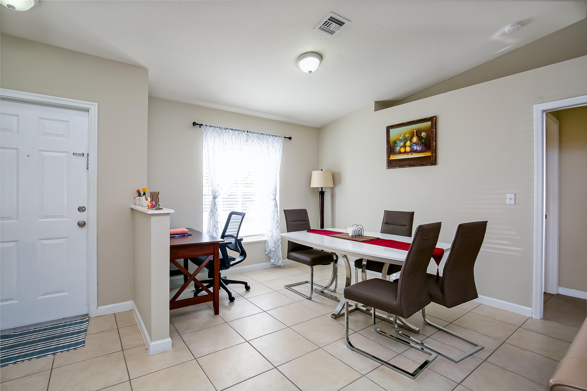 2065 Southwest Gemini Lane Port St. Lucie, FL 34984 - Photo 8 of 24 a work room with furniture and rug