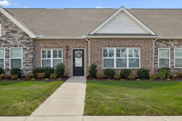 front view of a house with a yard
