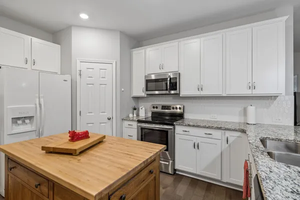 a kitchen that has a sink and a stove