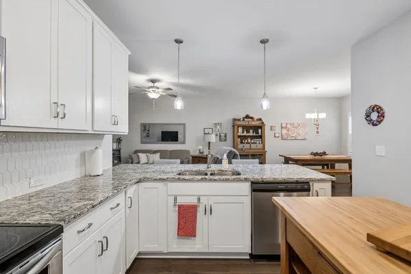 a kitchen with a sink and cabinets