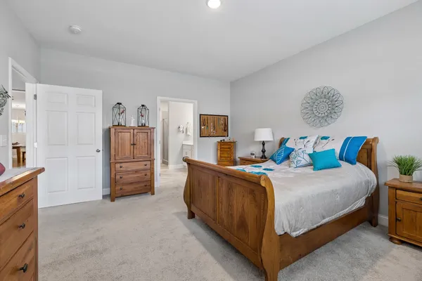 a bedroom with a bed and a cabinets