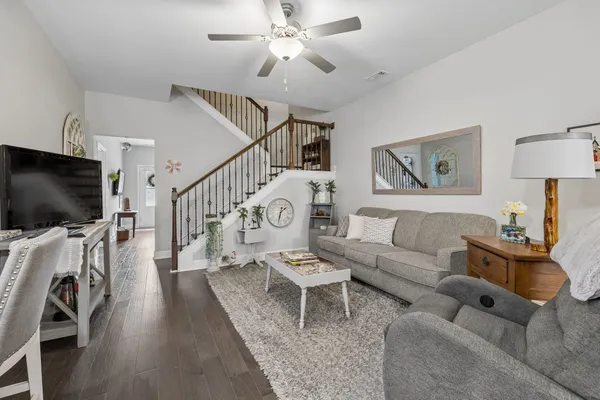 a living room with furniture and a flat screen tv