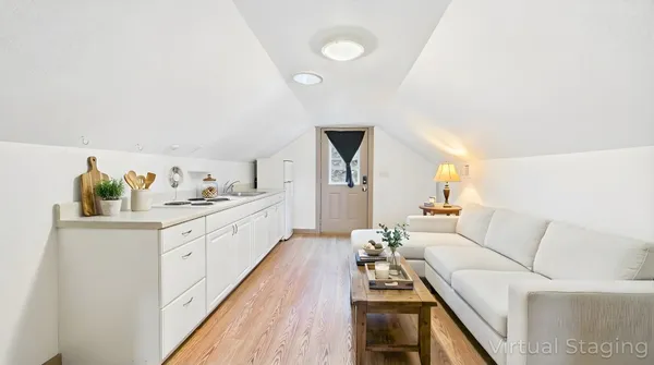a kitchen with stainless steel appliances granite countertop a sink a stove counter space and cabinets
