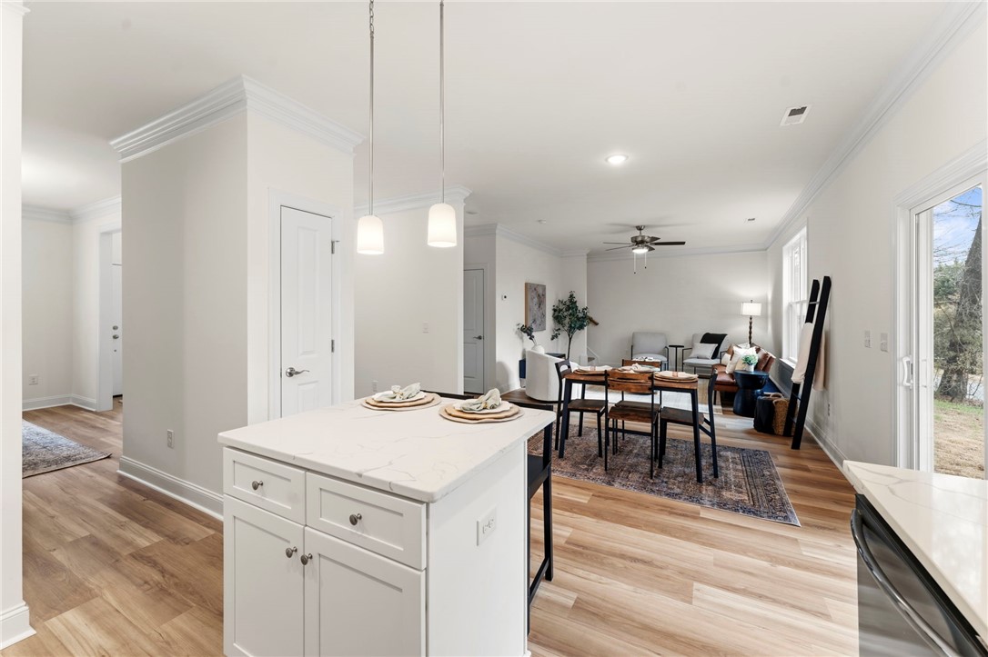 505 Fire Tower Road Williamston, SC 29697 - Photo 14 of 37 This inviting space features an open layout connecting the kitchen and living areas, perfect for daily living.