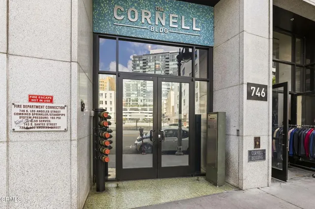 a view of a street with retail shops