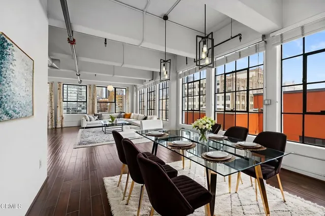 a view of a dining room with furniture window and wooden floor