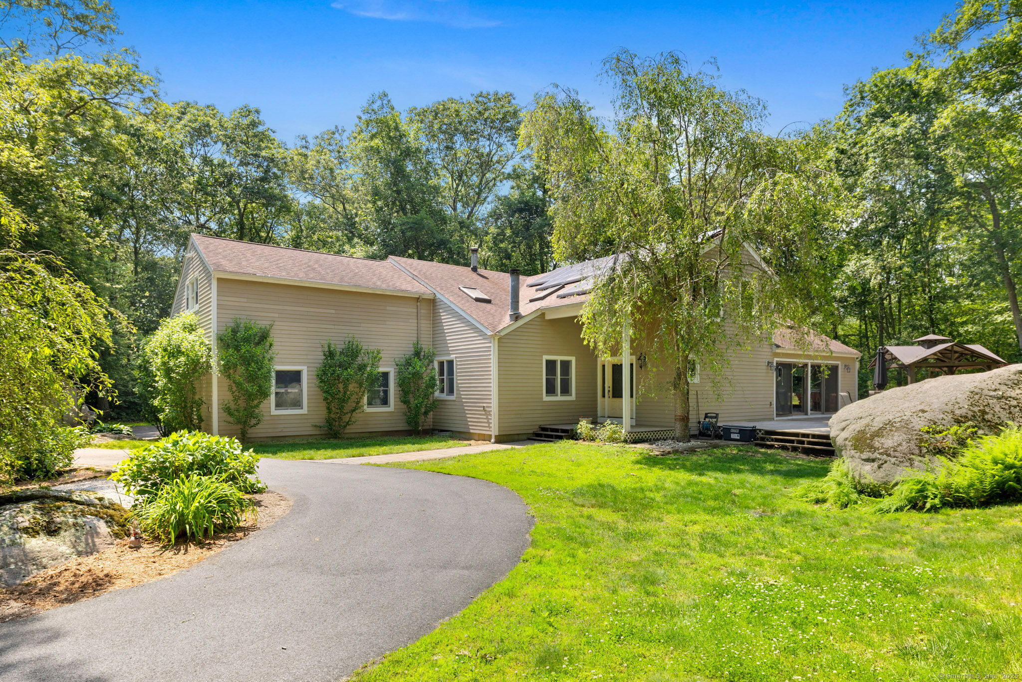 254 Haley Road Groton, CT 06355 - Photo 1 of 40 a front view of a house with a yard and trees