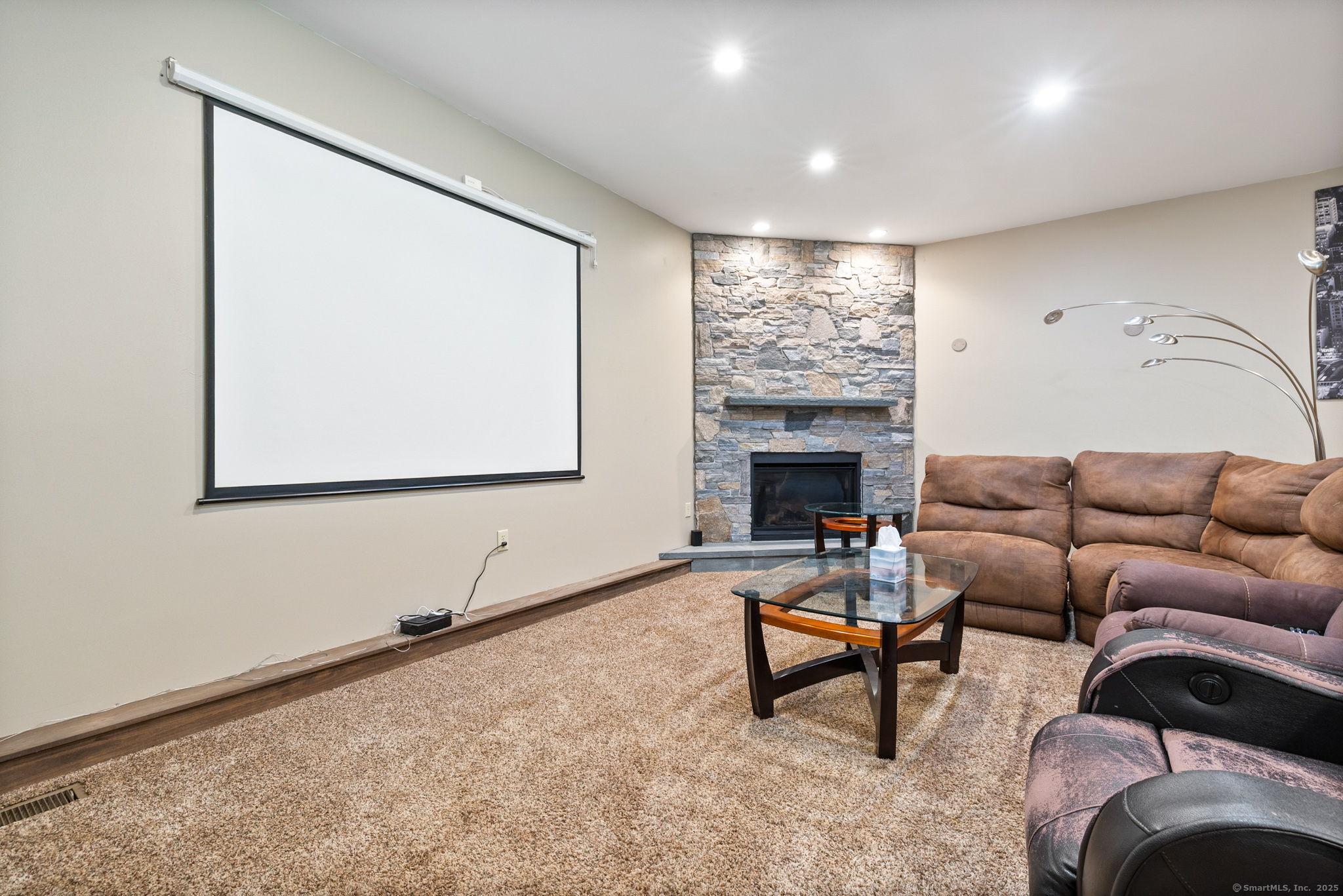 254 Haley Road Groton, CT 06355 - Photo 11 of 40 a living room with furniture and a fireplace