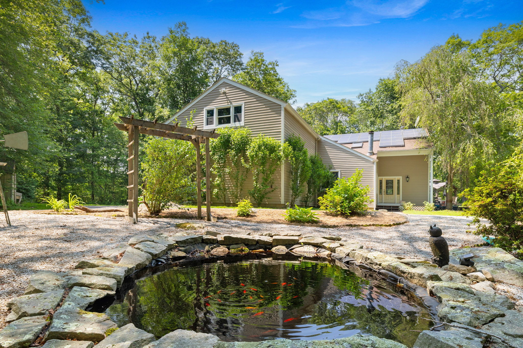 254 Haley Road Groton, CT 06355 - Photo 2 of 40 a view of a house with backyard and sitting area