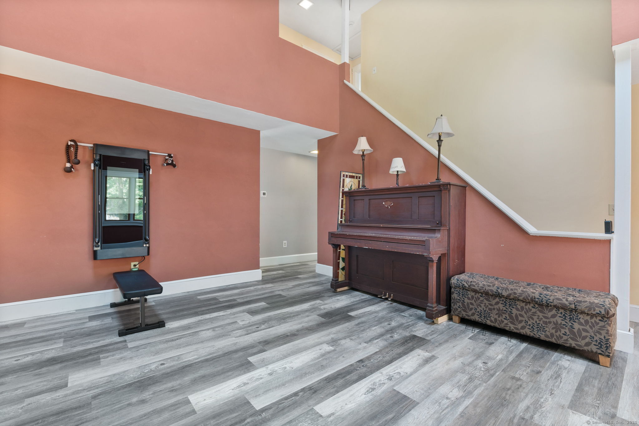 254 Haley Road Groton, CT 06355 - Photo 21 of 40 a view of a livingroom with furniture and stairs