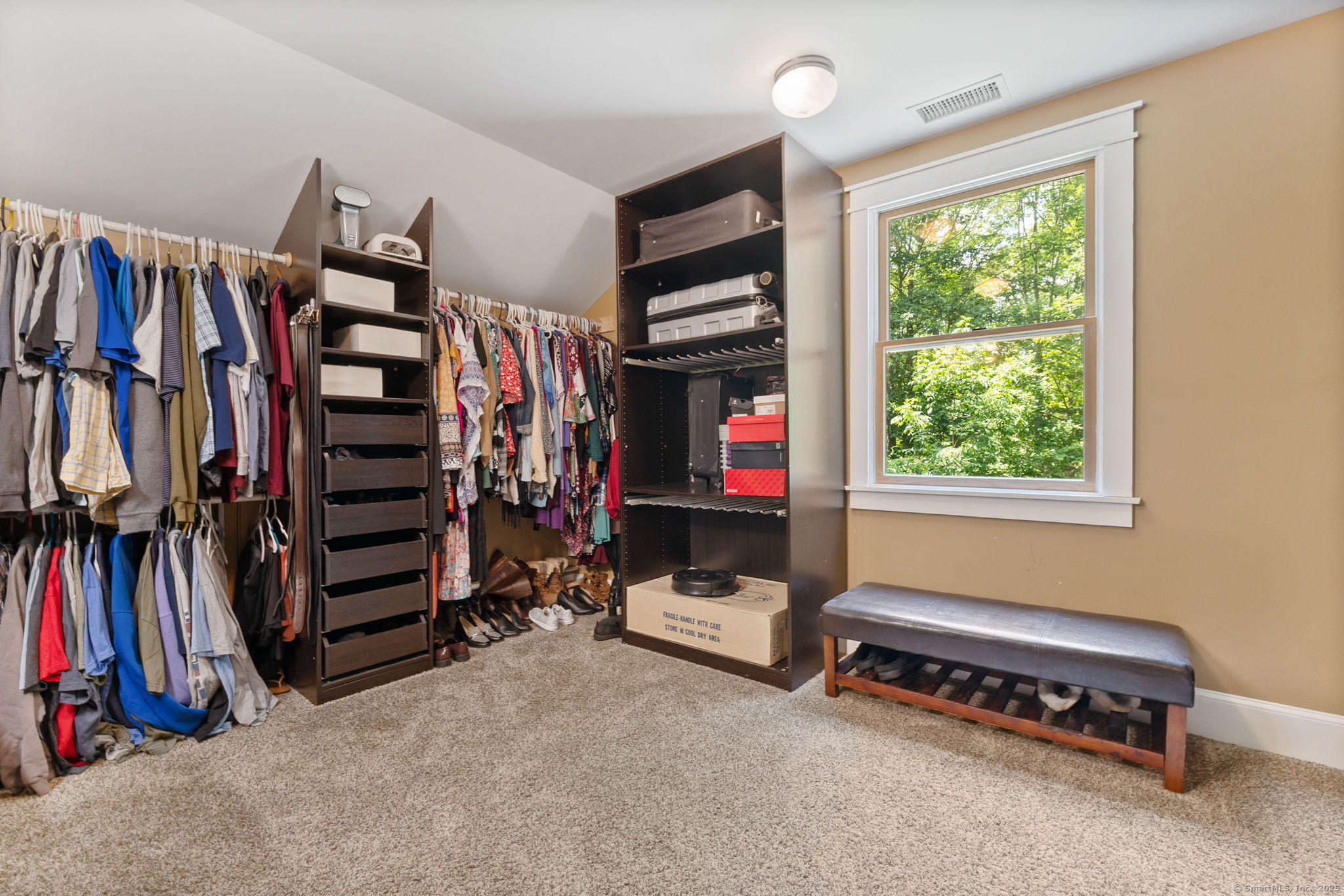 254 Haley Road Groton, CT 06355 - Photo 24 of 40 a view of walk in closet with clothes and shoes