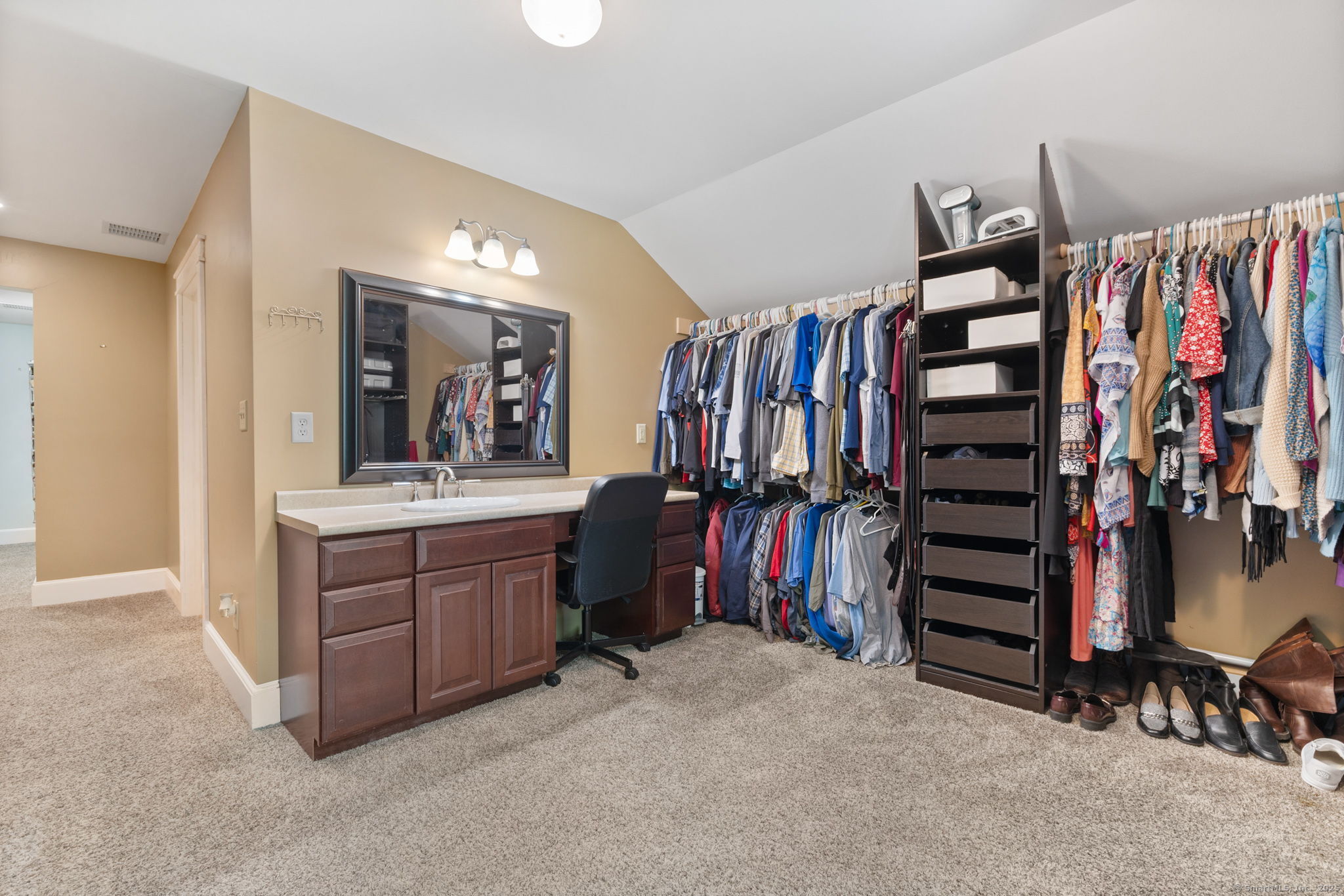 254 Haley Road Groton, CT 06355 - Photo 25 of 40 a view of walk in closet with clothes and shoes