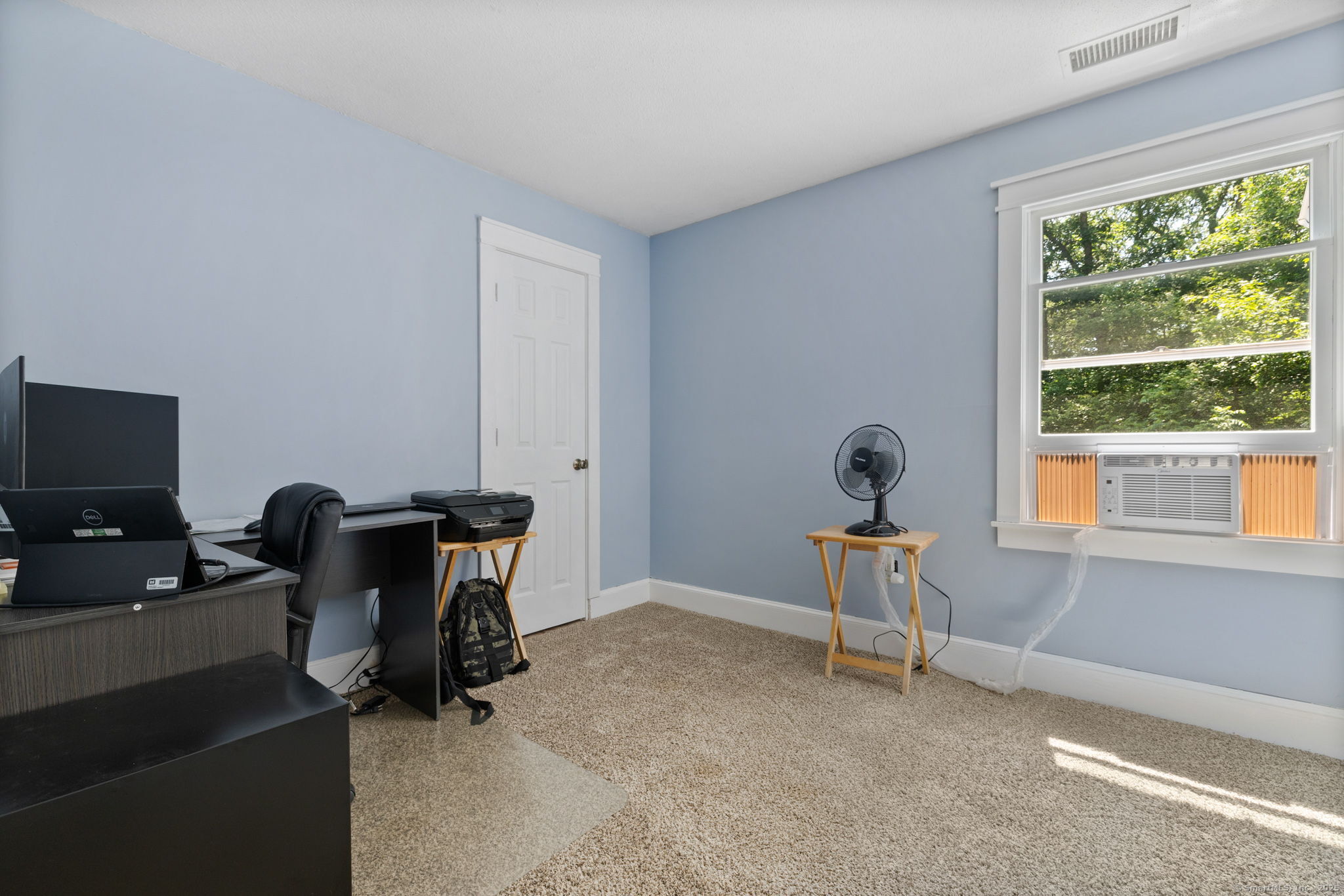 254 Haley Road Groton, CT 06355 - Photo 29 of 40 a view of a workspace with furniture and a window