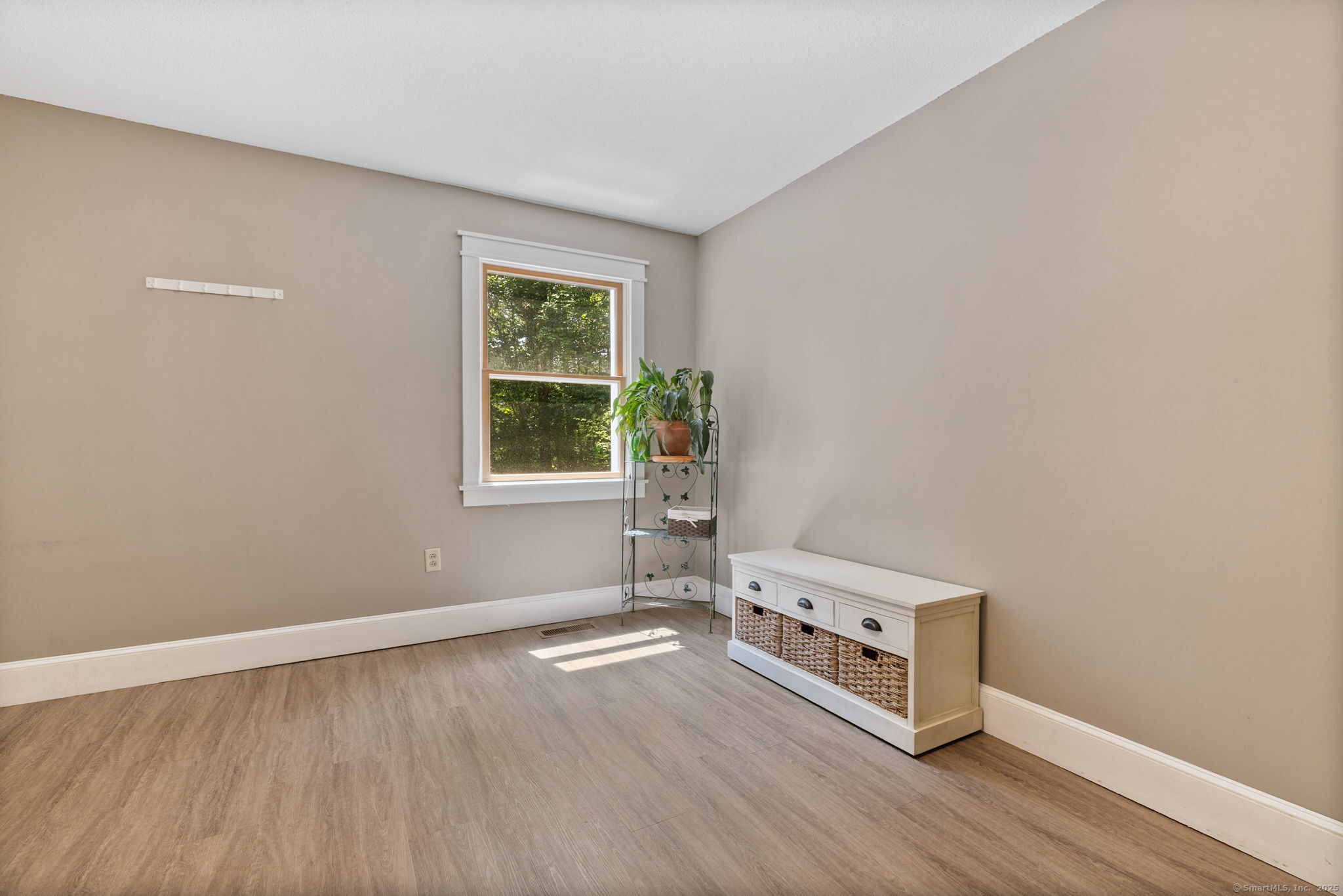 254 Haley Road Groton, CT 06355 - Photo 31 of 40 an empty room with wooden floor and windows