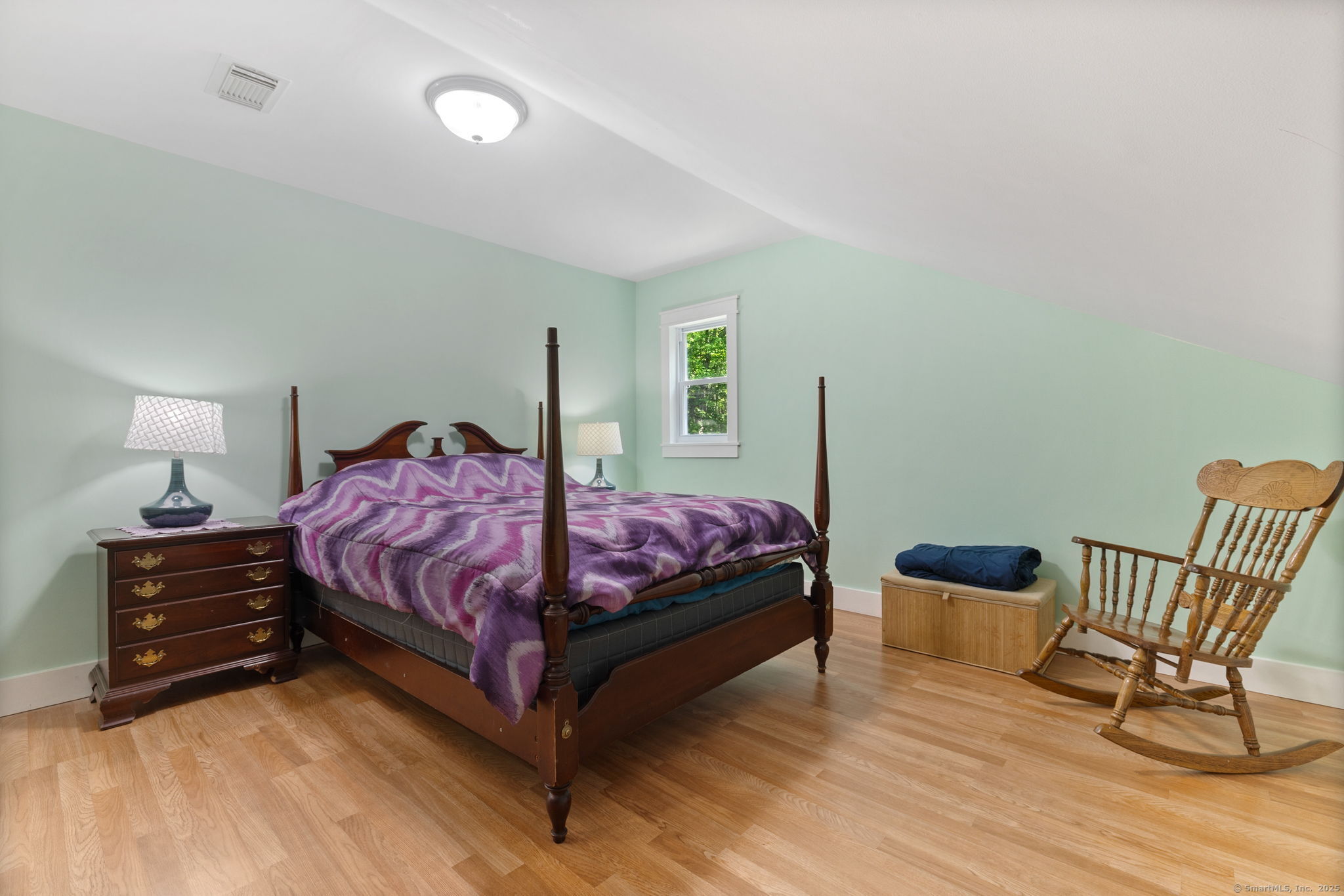 254 Haley Road Groton, CT 06355 - Photo 32 of 40 a bedroom with a bed and chair