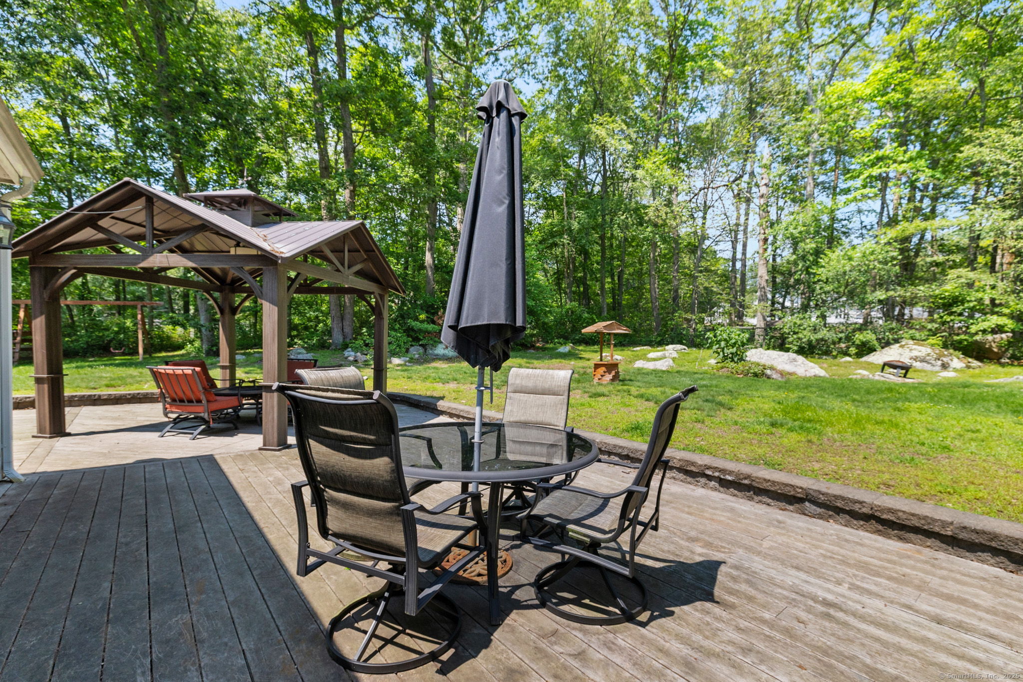 254 Haley Road Groton, CT 06355 - Photo 39 of 40 a view of a table and chairs in patio with wooden floor