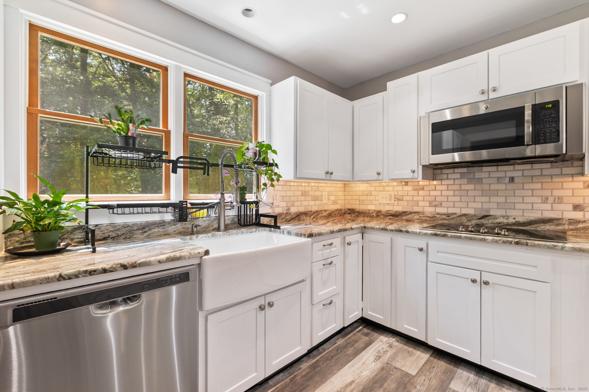 254 Haley Road Groton, CT 06355 - Photo 5 of 40 a kitchen with granite countertop a sink stainless steel appliances and cabinets