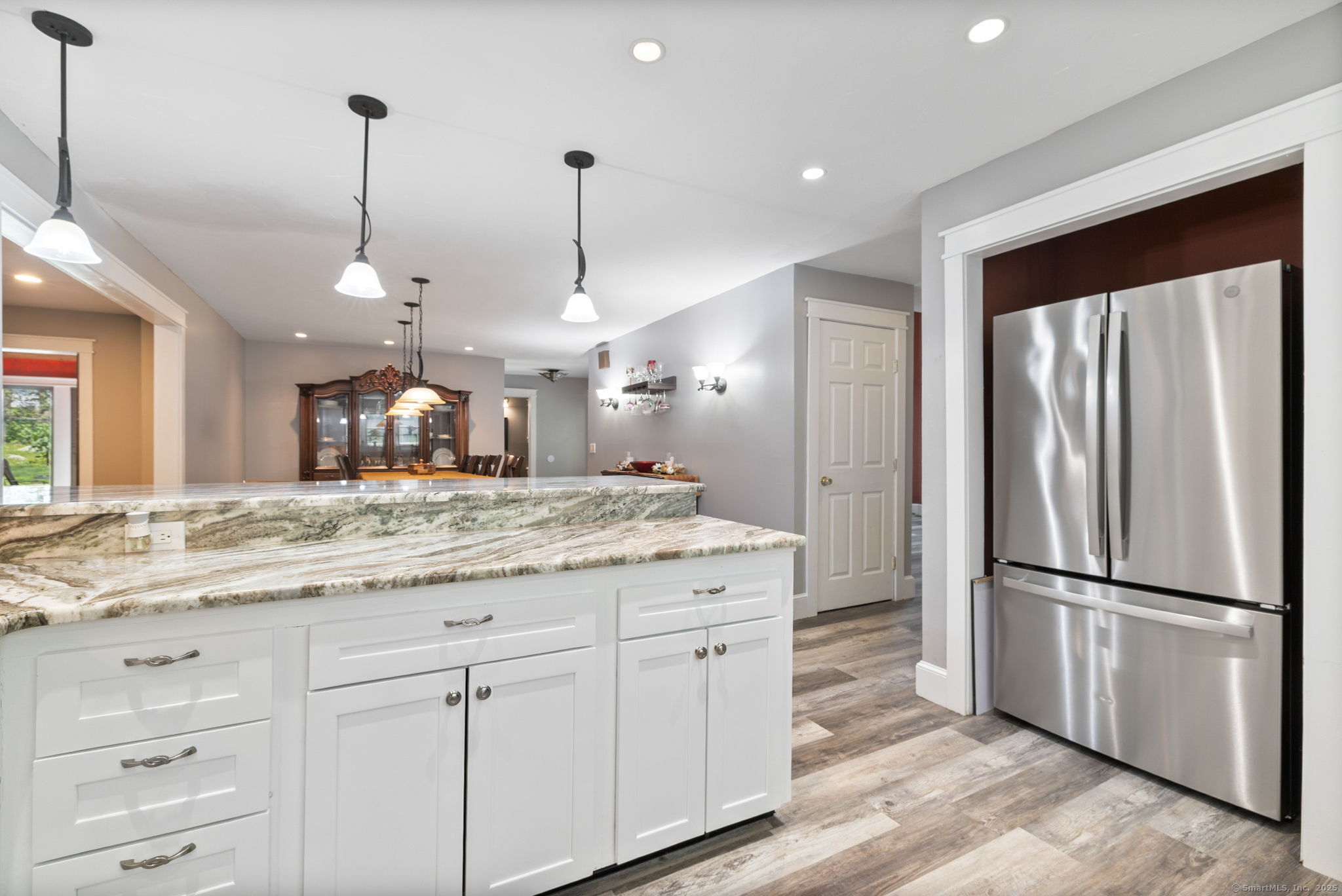 254 Haley Road Groton, CT 06355 - Photo 7 of 40 a kitchen with kitchen island white cabinets and stainless steel appliances