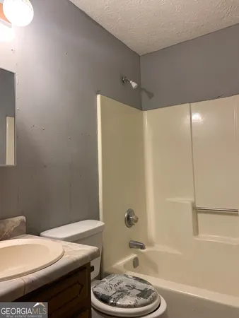 a bathroom with a sink and a toilet