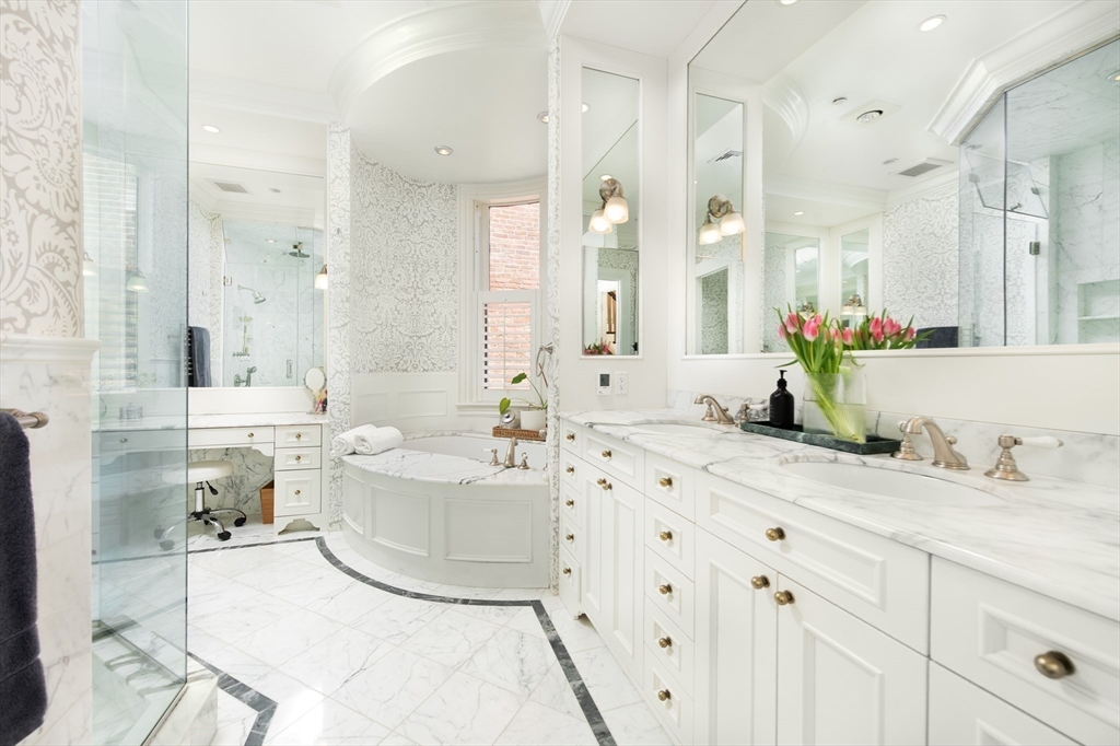 304 Commonwealth Avenue, Unit PH Boston, MA 02115 - Photo 20 of 42 a bathroom with a tub sink double and mirror