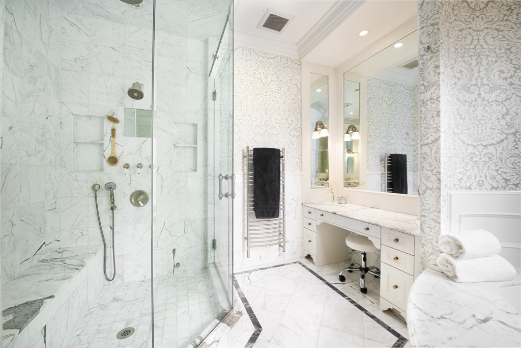 304 Commonwealth Avenue, Unit PH Boston, MA 02115 - Photo 21 of 42 a bathroom with a tub sink and mirror