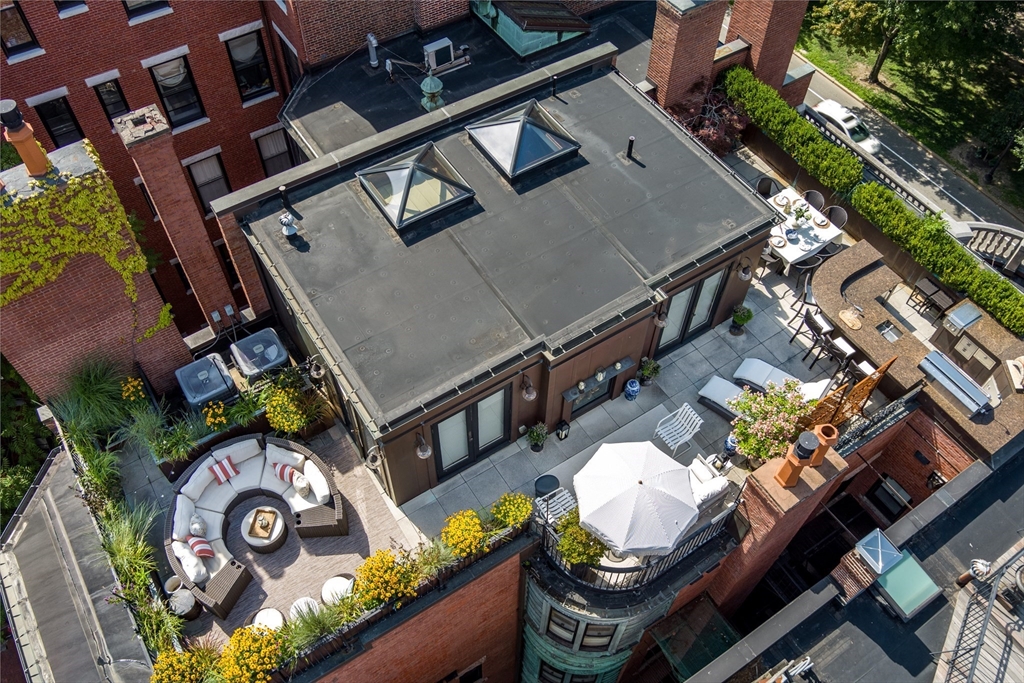 304 Commonwealth Avenue, Unit PH Boston, MA 02115 - Photo 40 of 42 an aerial view of a house with outdoor space and sitting area